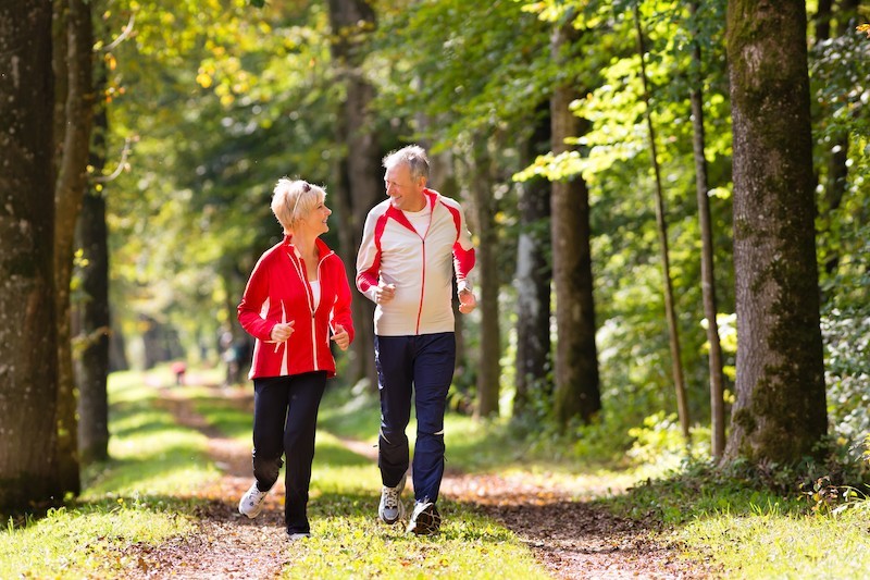 Couple jogging in woods