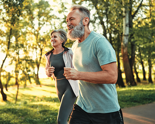 Couple jogging in woods
