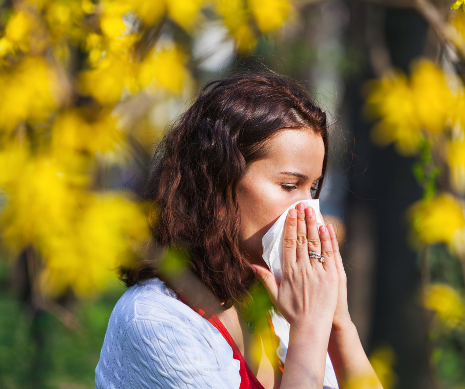 Woman blowing her nose